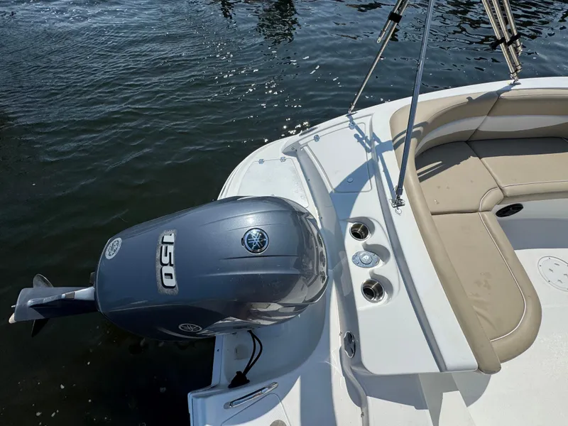 Slide: The Image of 2017 Hurricane SunDeck Sport 203 OB boat with Yamaha 150 outboard motor on water. - 8