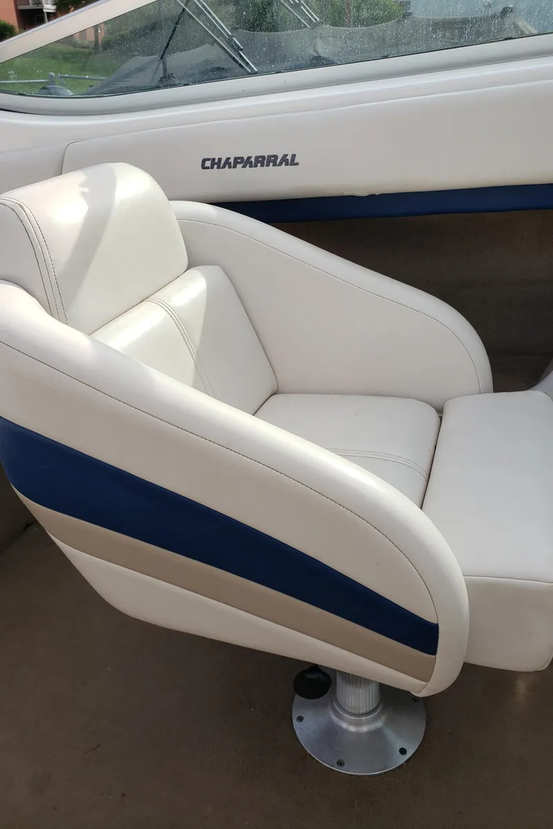 Slide: The Image of White and blue seat in 1999 Chaparral 2335 SS boat interior. - 6