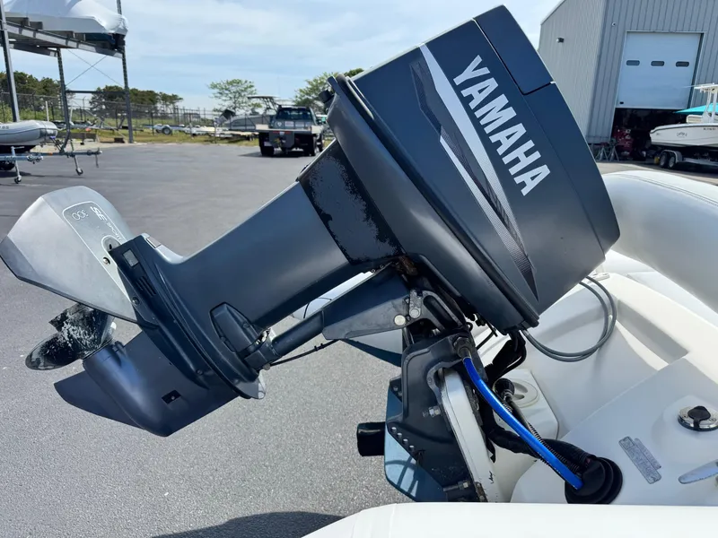 Slide: The Image of Outboard motor on Zodiac YL 420 DL boat, Yamaha branding visible, parked in marina. - 10