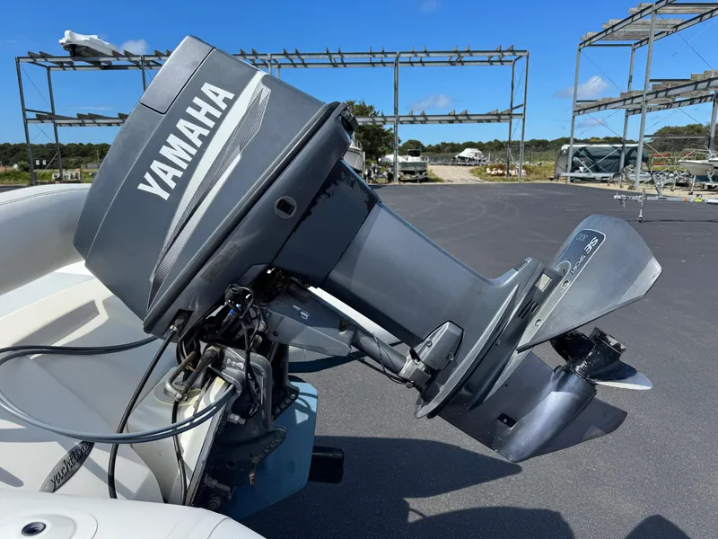 Slide: The Image of Yamaha outboard motor on Zodiac YL 420 DL boat, 2000 model, in a marina setting. - 11