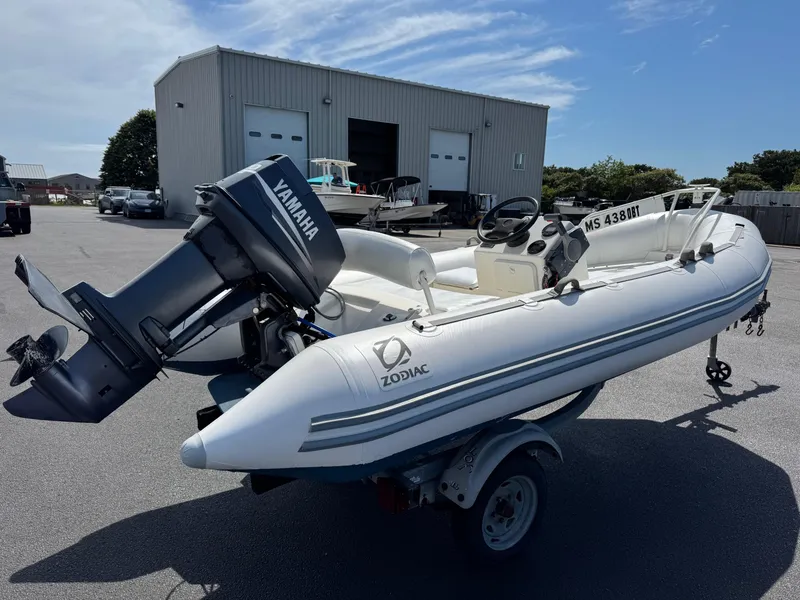 Slide: The Image of 2000 Zodiac YL 420 DL inflatable boat with Yamaha outboard motor on trailer. - 4