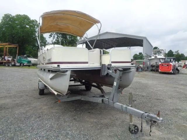 Slide: The Image of 2002 Lowe Suncruiser Trinidad 184 pontoon boat on trailer, parked outdoors. - 10