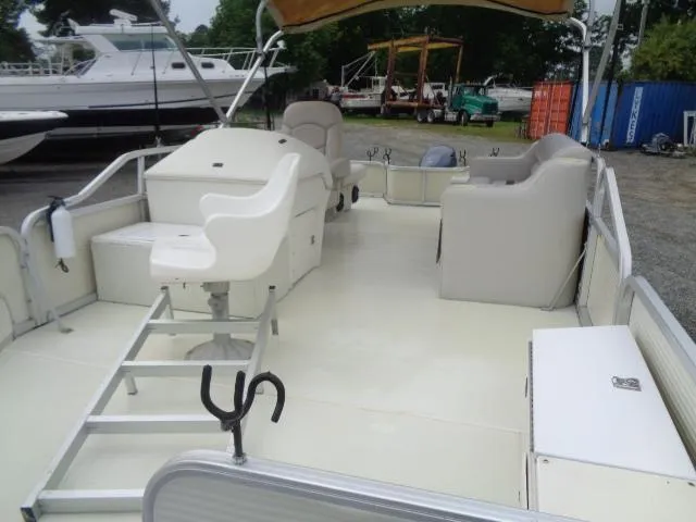 Slide: The Image of 2002 Lowe Suncruiser Trinidad 184 pontoon boat with spacious deck and seating. - 11