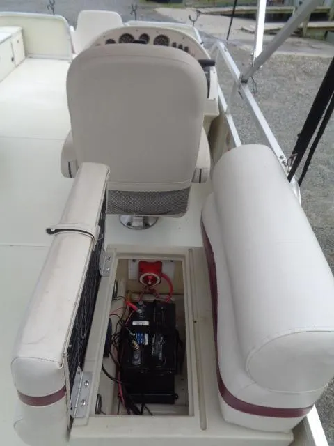 Slide: The Image of 2002 Lowe Suncruiser Trinidad 184 boat interior with battery compartment open. - 17