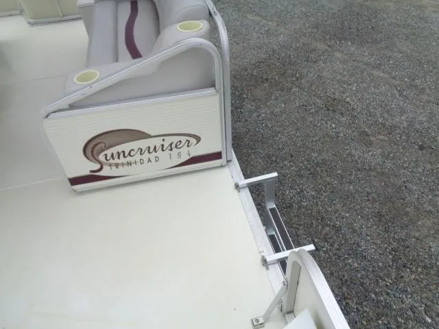 Slide: The Image of 2002 Lowe Suncruiser Trinidad 184 boat interior with seating and logo detail. - 21