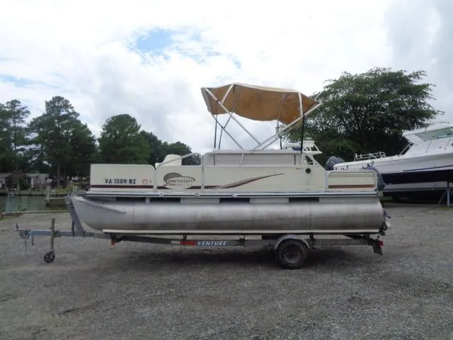 Slide: The Image of 2002 Lowe Suncruiser Trinidad 184 pontoon boat on trailer with canopy, parked outdoors. - 3