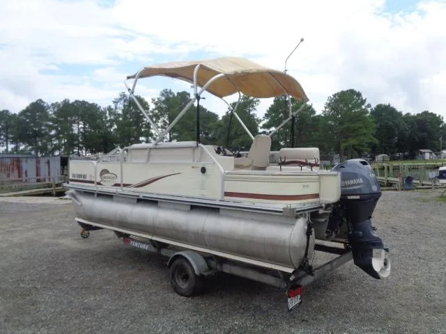 Slide: The Image of 2002 Lowe Suncruiser Trinidad 184 pontoon boat on trailer with Yamaha outboard motor. - 4