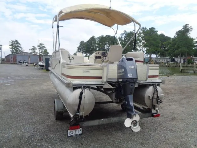 Slide: The Image of 2002 Lowe Suncruiser Trinidad 184 pontoon boat with Yamaha 50 engine, parked near a lake. - 5