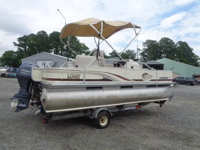 Slide: The Image of 2002 Lowe Suncruiser Trinidad 184 pontoon boat on trailer with canopy and Yamaha motor. - 7