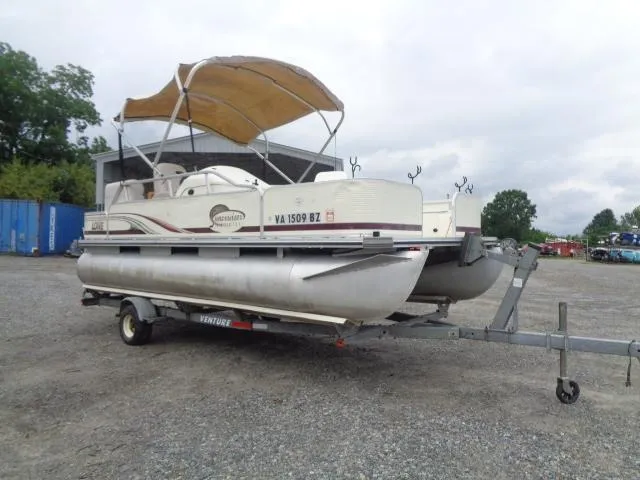 Slide: The Image of 2002 Lowe Suncruiser Trinidad 184 pontoon boat on trailer, parked outdoors. - 9