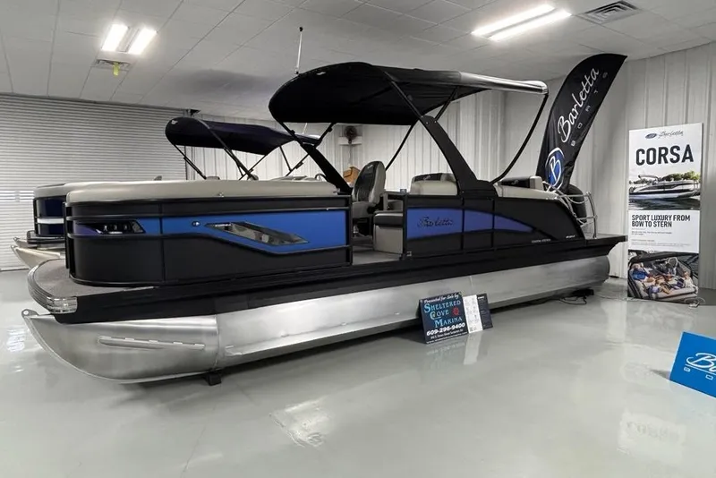 The Image of 2026 Barletta Corsa pontoon boat displayed indoors with sleek design and modern features. - 0