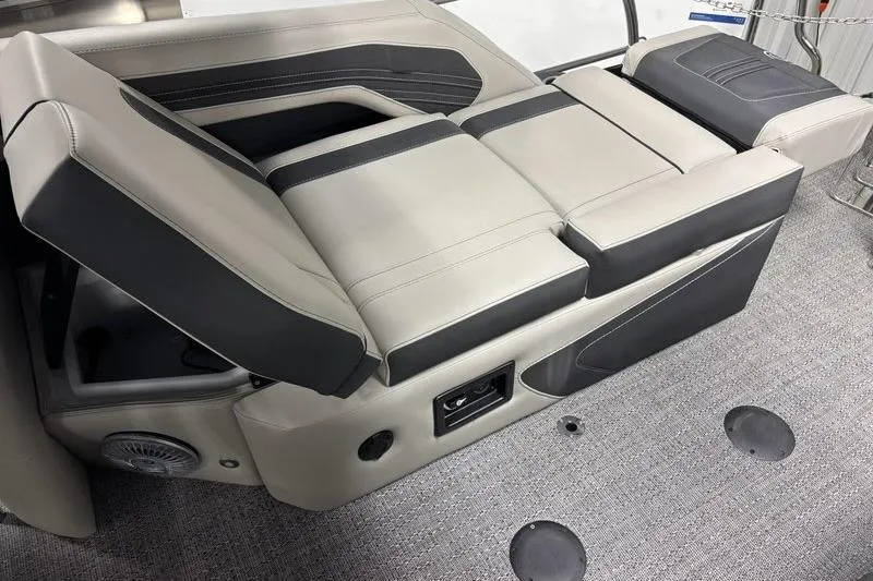 Slide: The Image of 2026 Barletta Corsa boat seating with gray and black upholstery, featuring integrated speaker and controls. - 11