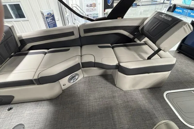 Slide: The Image of 2026 Barletta Corsa boat interior with beige and black seating, showcasing modern design and comfort. - 13