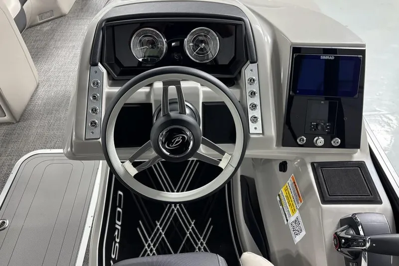Slide: The Image of 2026 Barletta Corsa boat dashboard with steering wheel and control panel. - 5