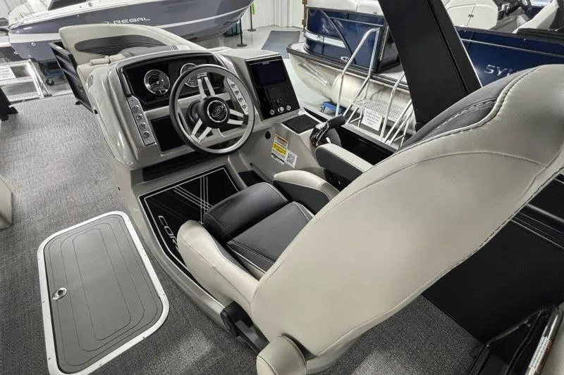 Slide: The Image of 2026 Barletta Corsa boat interior with modern steering and dashboard controls. - 7