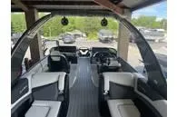 Slide: The Image of 2023 South Bay 25Sport RS9 DC 3.0+ boat interior with modern seating and dashboard. - 11