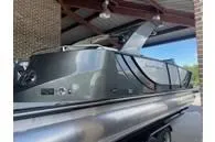 Slide: The Image of 2023 South Bay 25Sport RS9 DC 3.0+ pontoon boat under a covered dock. - 12