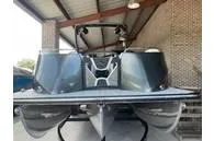 Slide: The Image of 2023 South Bay 25Sport RS9 DC 3.0+ pontoon boat in a covered dock. - 13