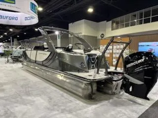 Slide: The Image of 2023 South Bay 25Sport RS9 DC 3.0+ pontoon boat displayed indoors. - 2