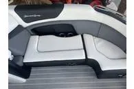 Slide: The Image of 2023 South Bay 25Sport RS9 DC 3.0+ boat interior seating, featuring sleek gray and white design. - 6