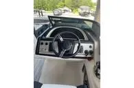 Slide: The Image of 2023 South Bay 25Sport RS9 DC 3.0+ boat dashboard with steering wheel and controls. - 8
