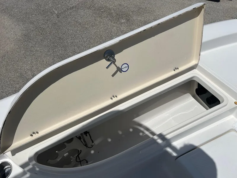 Slide: The Image of Open storage compartment on a 2011 NauticStar 2200 Tournament boat. - 17