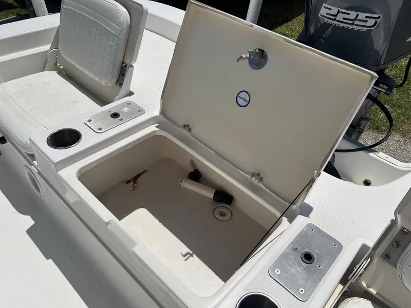 Slide: The Image of 2011 NauticStar 2200 Tournament boat interior with open storage compartment and seating. - 20