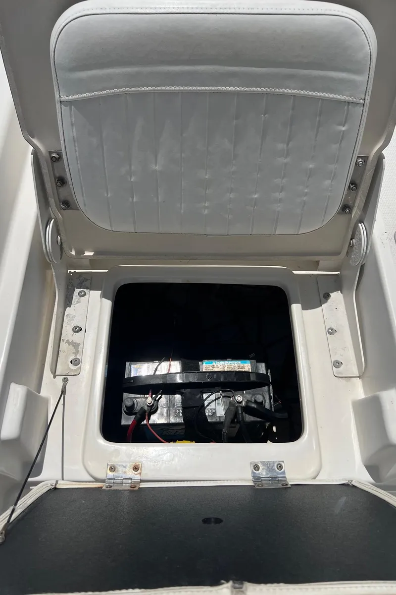 Slide: The Image of Open battery compartment of 2011 NauticStar 2200 Tournament boat. - 22