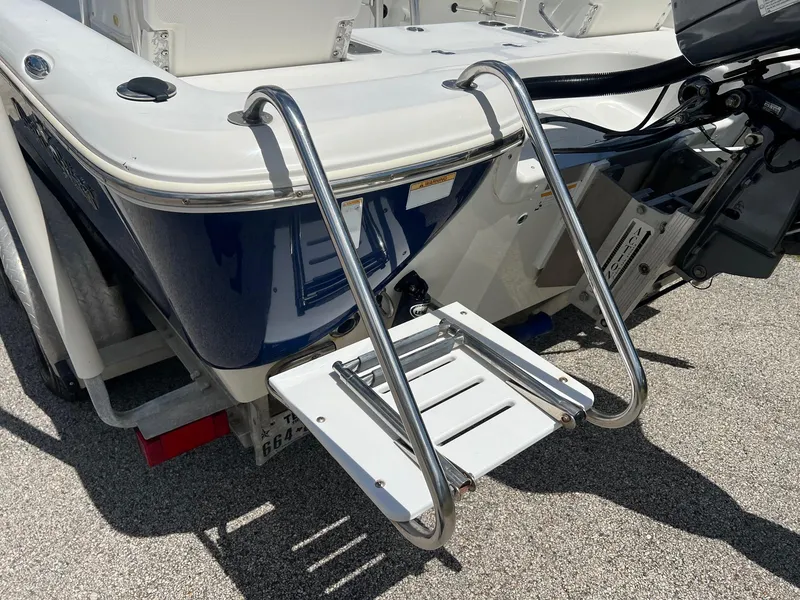 Slide: The Image of 2011 NauticStar 2200 Tournament boat with stainless steel swim ladder on the stern. - 3