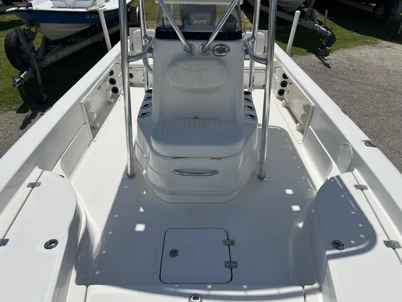Slide: The Image of 2011 NauticStar 2200 Tournament boat interior with seating and storage compartments. - 9