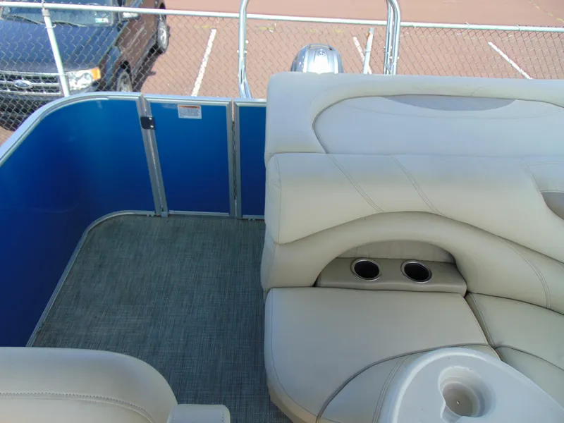 Slide: The Image of 2019 Sylvan Mirage 820 Cruise interior with beige seating and cup holders. - 11