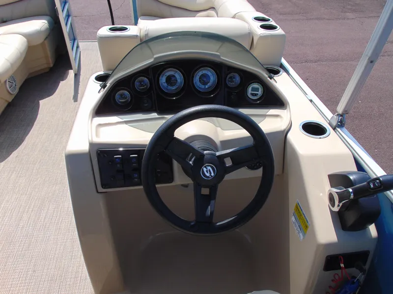 Slide: The Image of 2019 Sylvan Mirage 820 Cruise dashboard with steering wheel and control panel. - 12