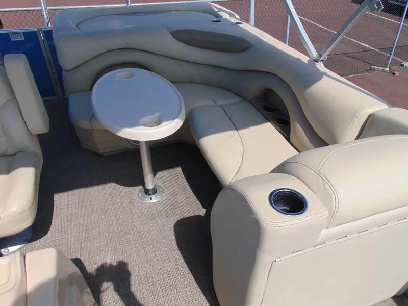 Slide: The Image of Luxurious seating area on 2019 Sylvan Mirage 820 Cruise pontoon boat with beige upholstery. - 8