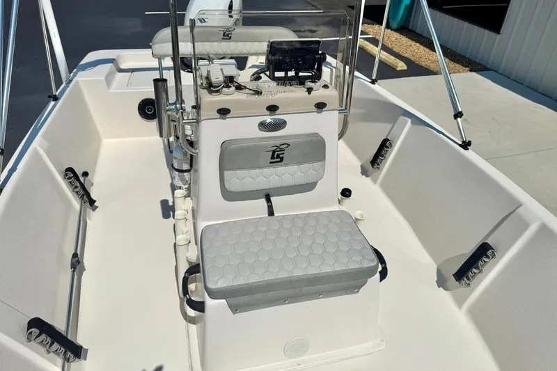 Slide: The Image of 2025 Carolina Skiff EV180 Sea Skiff interior with seating and console, showcasing modern design. - 11