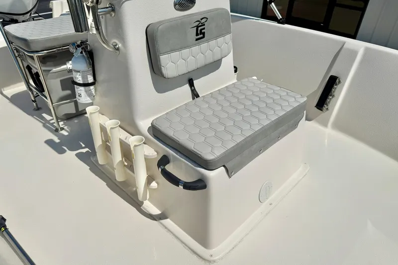 Slide: The Image of 2025 Carolina Skiff EV180 Sea Skiff interior with seating and rod holders. - 12