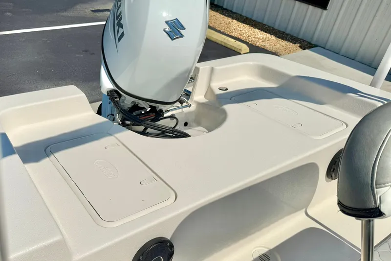 Slide: The Image of 2025 Carolina Skiff EV180 Sea Skiff with Suzuki outboard motor, rear deck view. - 20