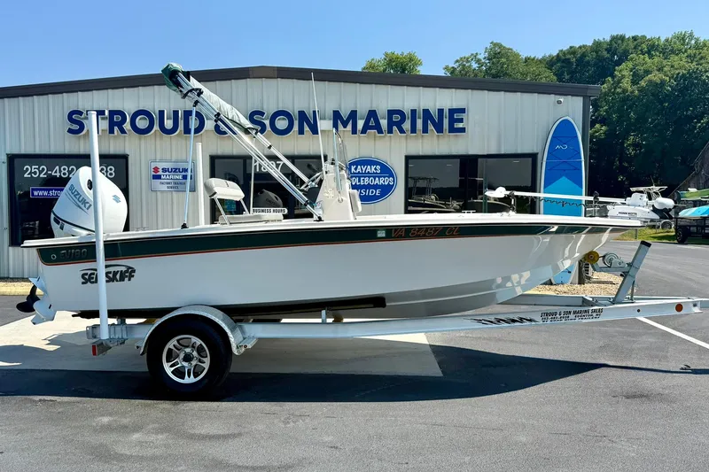 Slide: The Image of 2025 Carolina Skiff EV180 Sea Skiff on trailer at Stroud & Son Marine dealership. - 6
