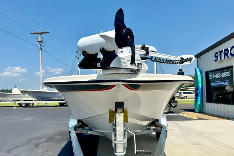 Slide: The Image of 2025 Carolina Skiff EV180 Sea Skiff on trailer, featuring Minn Kota trolling motor. - 7