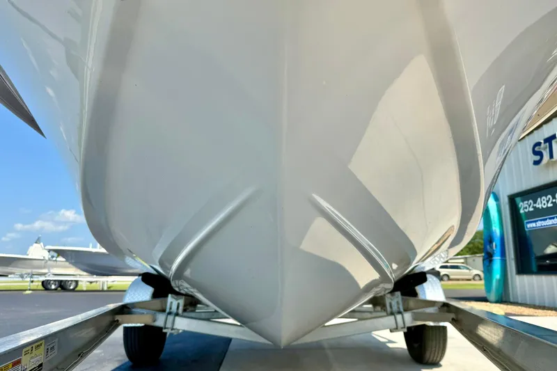 Slide: The Image of 2025 Carolina Skiff EV180 Sea Skiff hull on trailer, close-up view. - 8