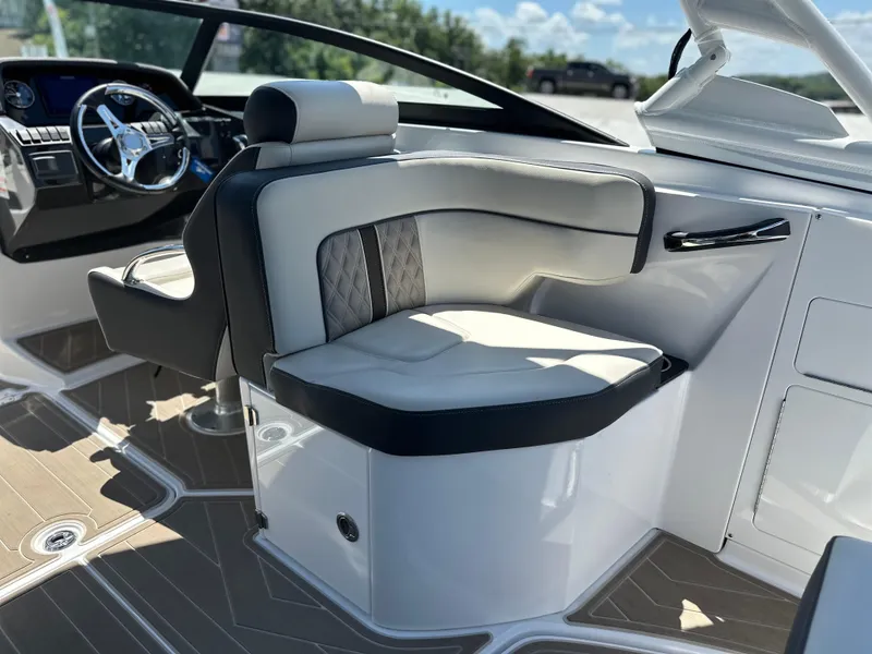 Slide: The Image of Luxurious interior of 2024 Monterey M-65 boat with plush seating and modern dashboard. - 15