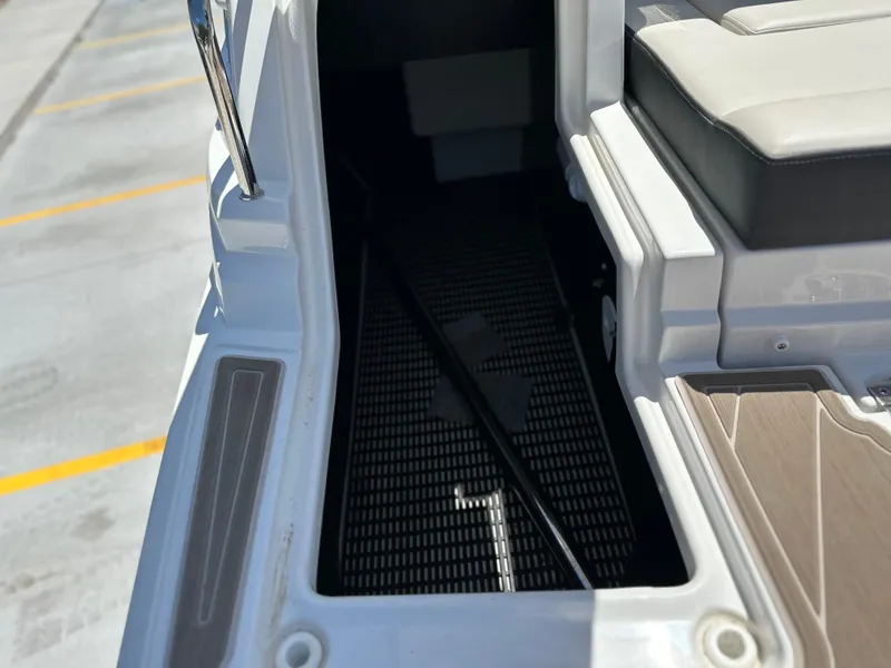 Slide: The Image of 2024 Monterey M-65 boat interior with seating and storage compartment. - 18