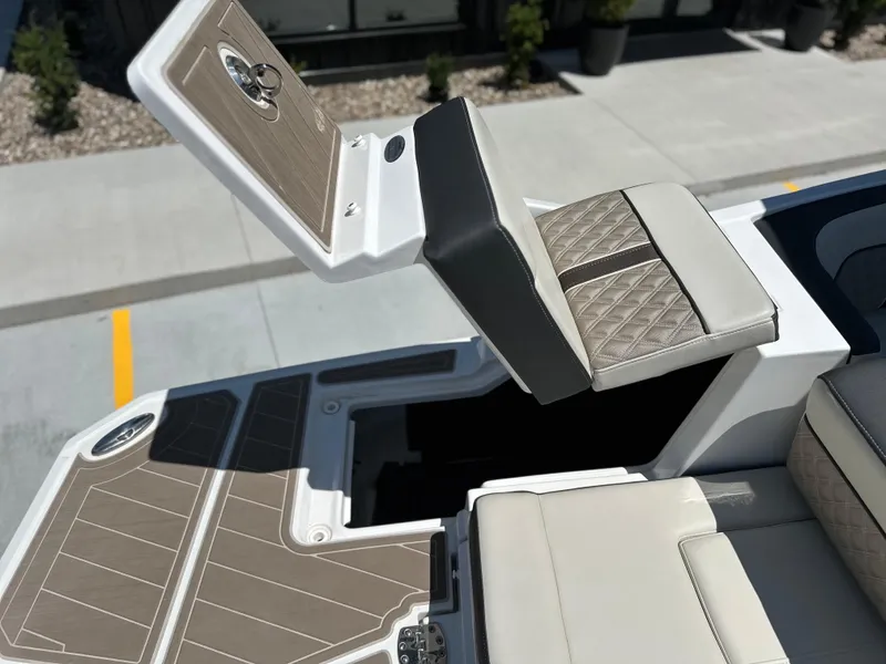 Slide: The Image of 2024 Monterey M-65 boat with luxurious seating and storage compartment. - 19