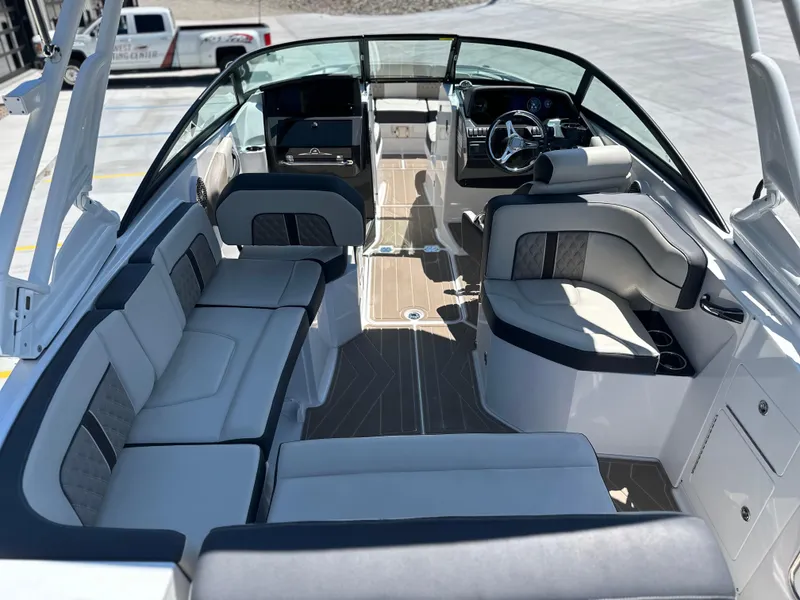 Slide: The Image of 2024 Monterey M-65 boat interior with luxurious seating and modern dashboard design. - 2