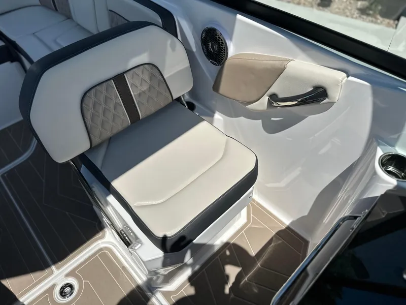 Slide: The Image of 2024 Monterey M-65 boat interior with cushioned seating and modern design. - 7
