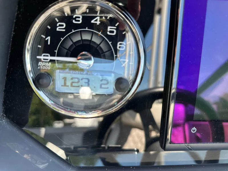 Slide: The Image of Close-up of 2024 Monterey M-65 tachometer displaying 123.2 engine hours. - 9