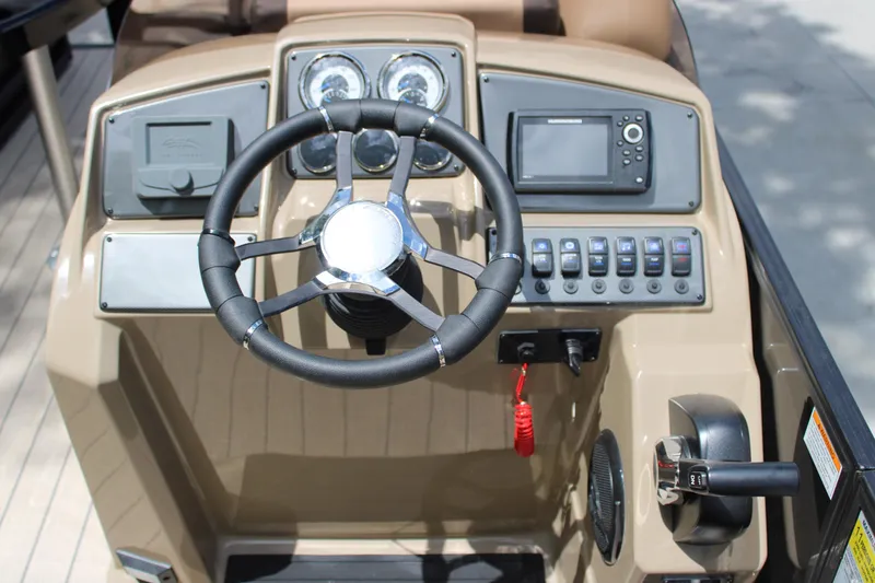 Slide: The Image of Steering console of 2026 Starcraft EXS 1 Q DH boat with gauges and controls. - 15