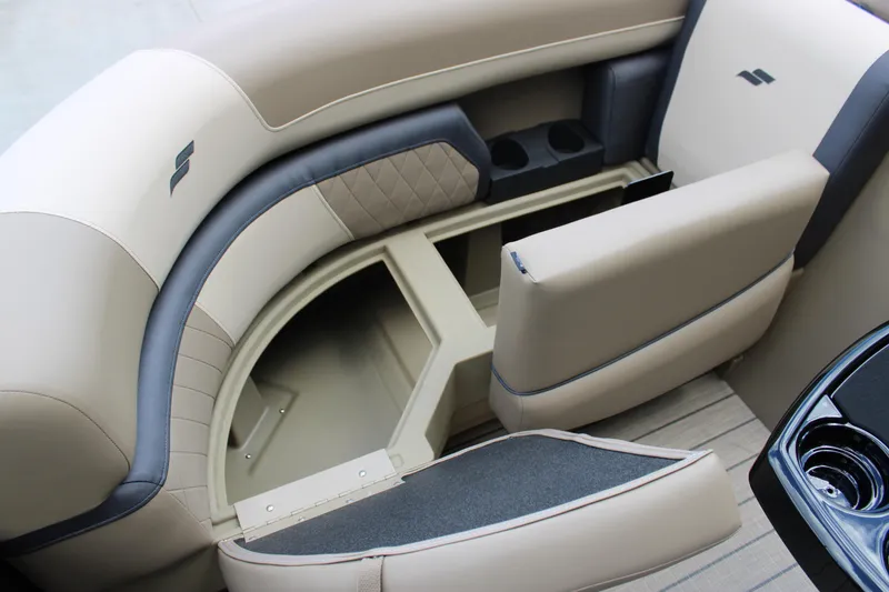 Slide: The Image of 2026 Starcraft EXS 1 Q DH boat interior with beige seating and storage compartments. - 18