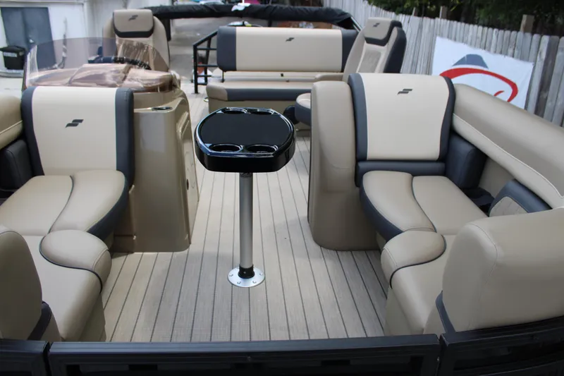 Slide: The Image of Luxurious 2026 Starcraft EXS 1 Q DH boat interior with beige seating and central table. - 20