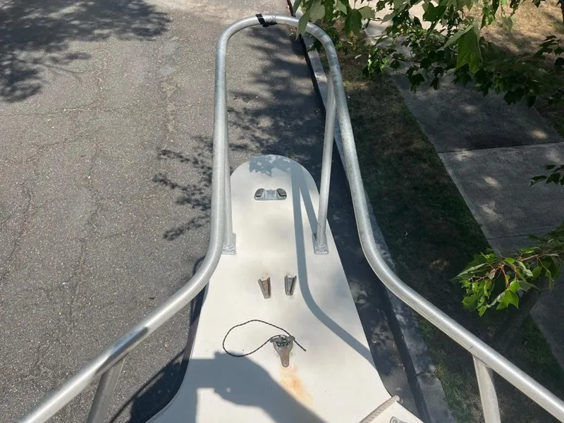 Slide: The Image of Bow view of 1989 Mako 210 WA boat with metal railings and anchor mount. - 25