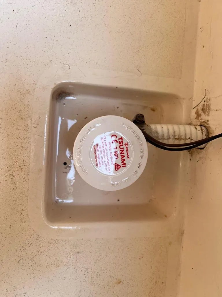 Slide: The Image of Bilge pump in 1989 Mako 210 WA boat, partially submerged in water. - 30